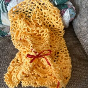 Vibrant Yellow Crochet Blanket with Red Ribbon